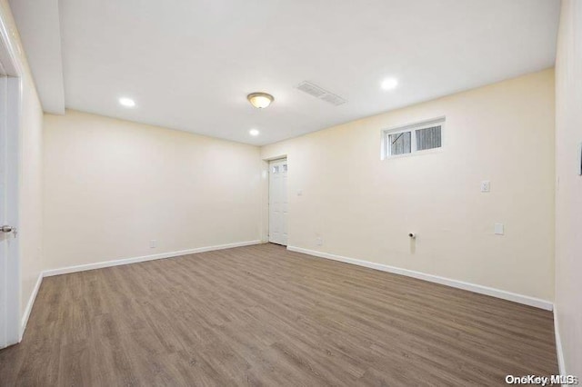 spare room with dark wood-type flooring