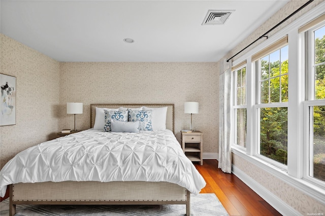 bedroom with hardwood / wood-style flooring