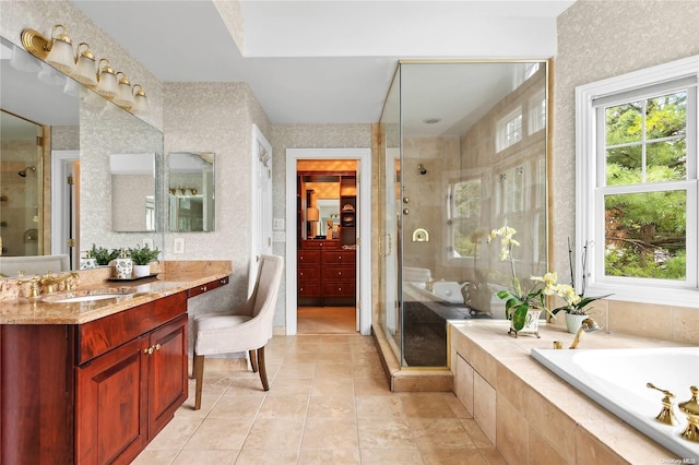 bathroom featuring separate shower and tub, tile patterned flooring, and vanity