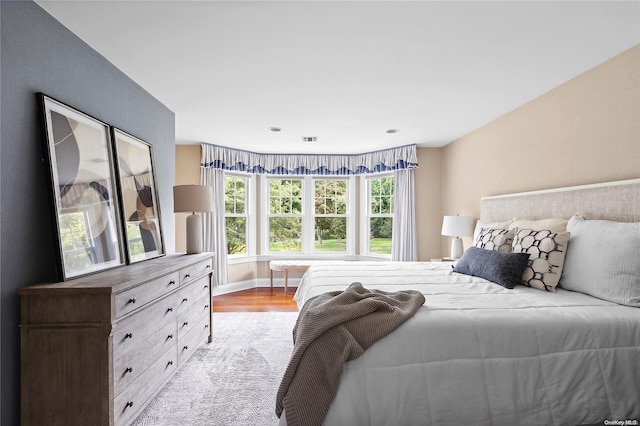 bedroom with light hardwood / wood-style floors