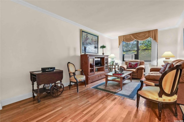 living room featuring crown molding, cooling unit, and wood-type flooring