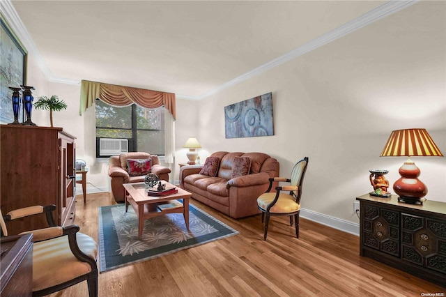 living room with crown molding, cooling unit, and light hardwood / wood-style floors