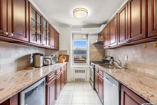 kitchen with sink, stainless steel appliances, tasteful backsplash, exhaust hood, and ornamental molding