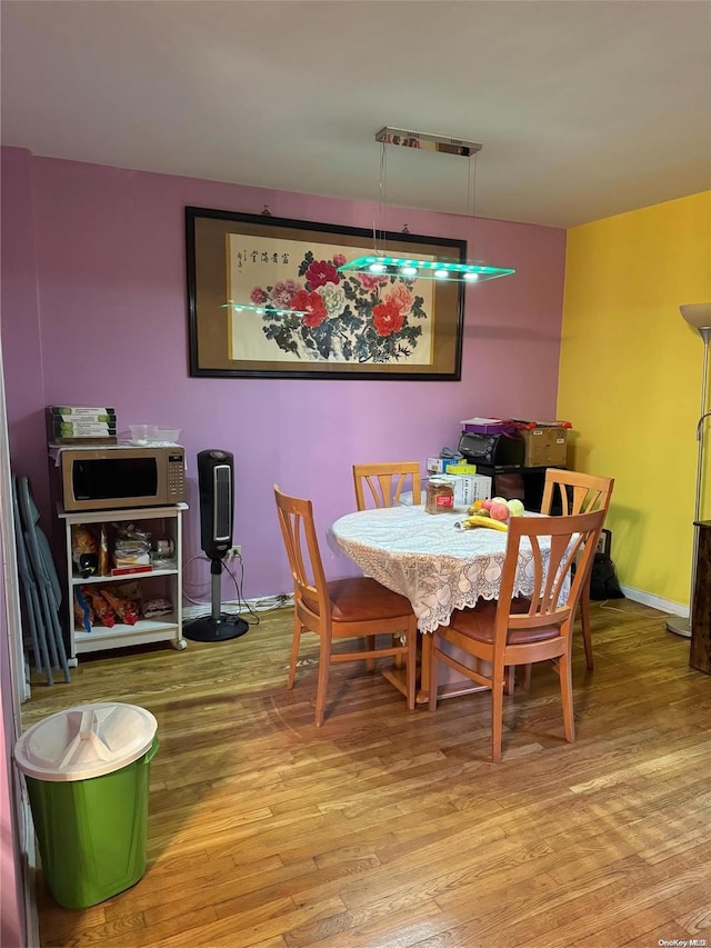 dining area with light hardwood / wood-style floors