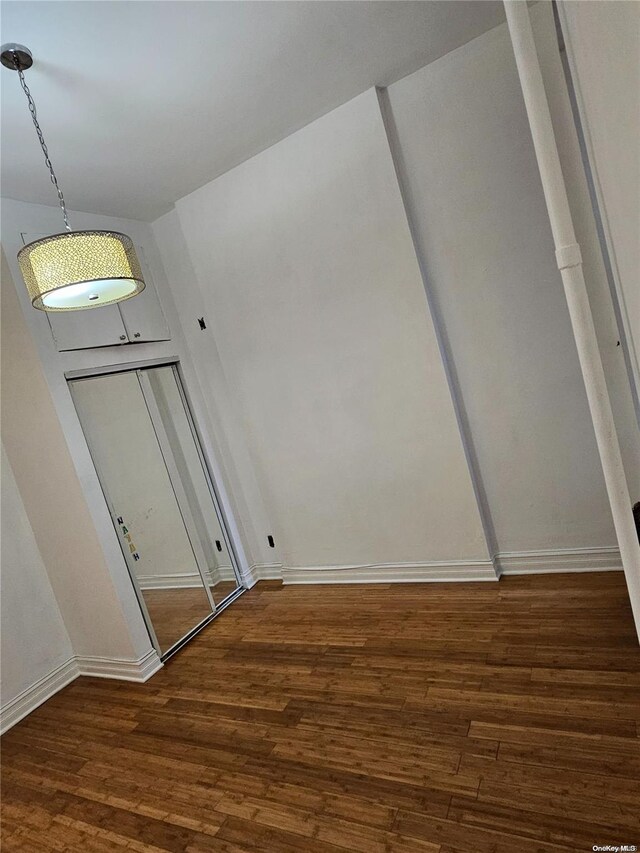344 W 48 Unit 1Re, New York Manhattan, NY 10036 - empty room featuring wood finished floors and baseboards