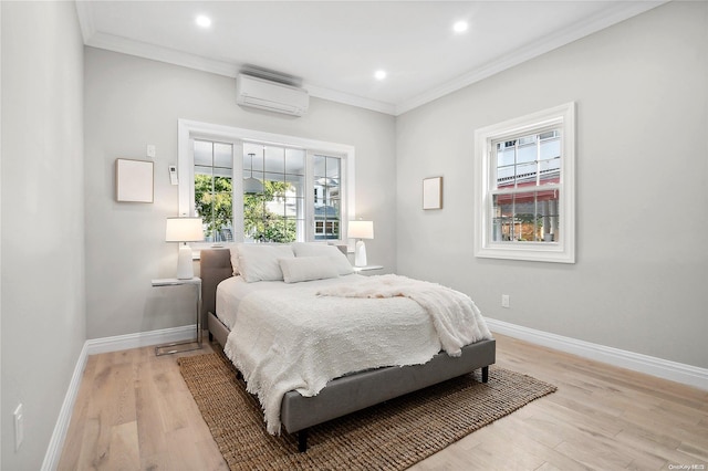 bedroom featuring multiple windows, light wood-type flooring, a wall mounted AC, and crown molding