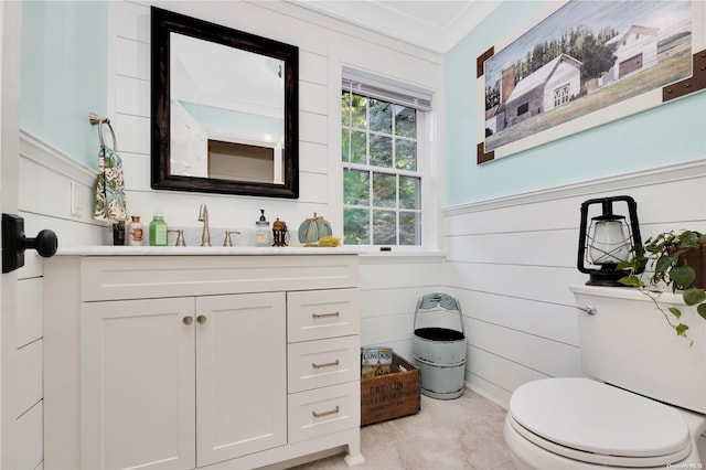 11A Sunken Meadow Rd Unit A, Northport, NY 11768 - bathroom with vanity, toilet, and wainscoting
