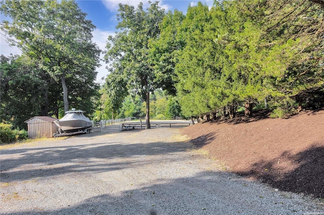 11A Sunken Meadow Rd Unit A, Northport, NY 11768 - view of dirt / gravel road with view of wooded area