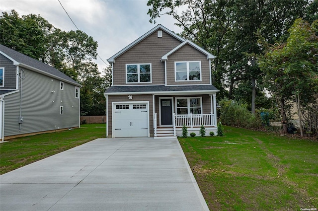 view of front of property with a garage, covered porch, and a front lawn