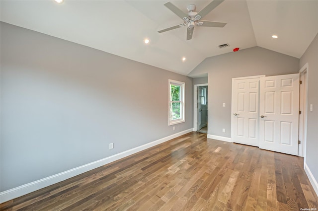 unfurnished bedroom featuring hardwood / wood-style floors, ceiling fan, and lofted ceiling