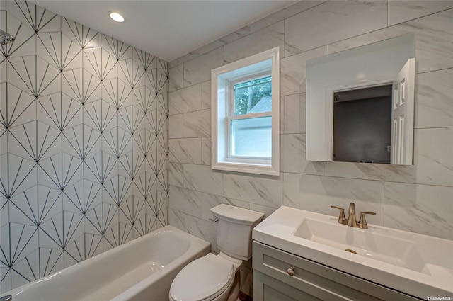 full bathroom with vanity, toilet, tile walls, and tiled shower / bath combo