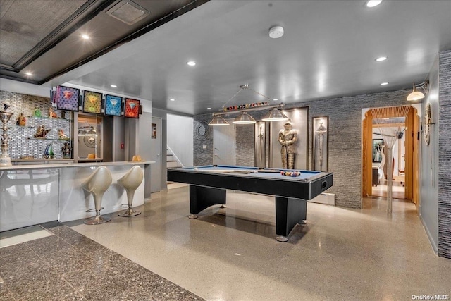 recreation room with bar area and pool table