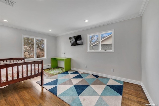 bedroom featuring wood-type flooring and ornamental molding