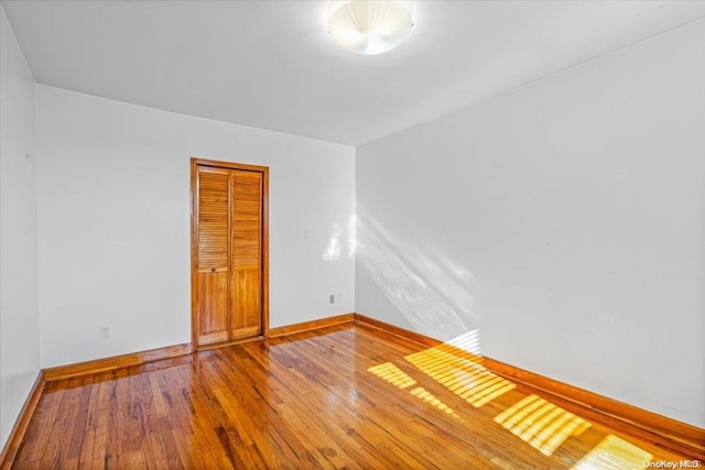 spare room featuring hardwood / wood-style floors