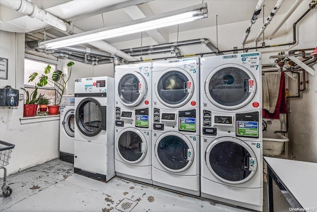 washroom with independent washer and dryer and stacked washing maching and dryer