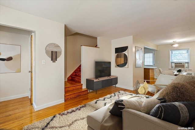 living room with hardwood / wood-style floors and cooling unit