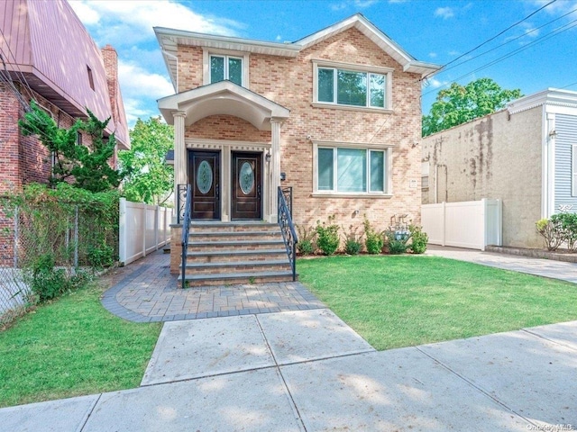 view of front of home with a front lawn