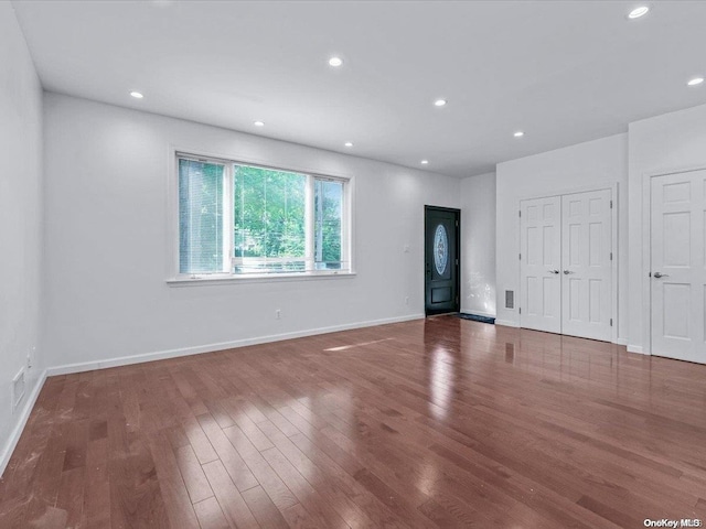 interior space with dark hardwood / wood-style floors