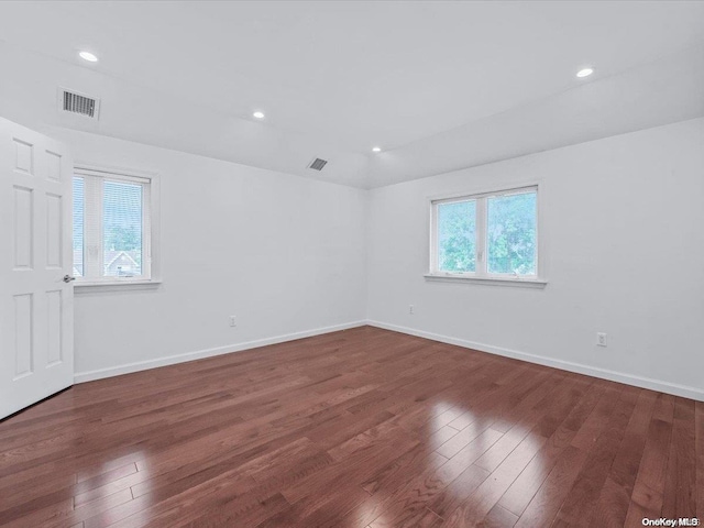 unfurnished room with dark hardwood / wood-style floors