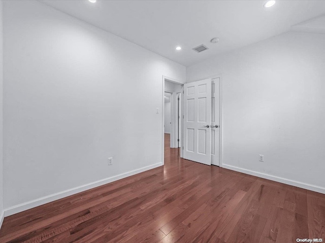 empty room featuring dark wood-type flooring