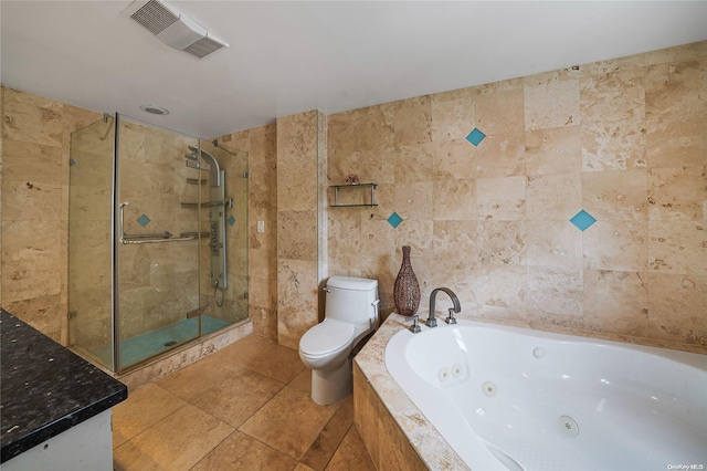 bathroom with tile patterned flooring, plus walk in shower, tile walls, and toilet