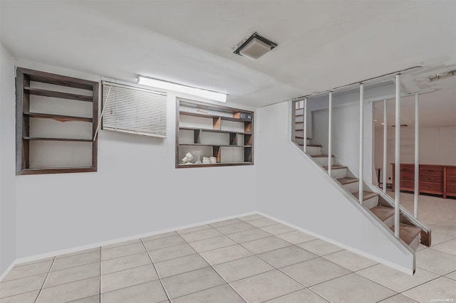 basement with light tile patterned floors