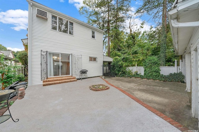 rear view of property featuring a patio area