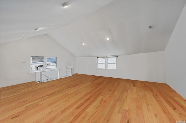 bonus room featuring light hardwood / wood-style floors and lofted ceiling