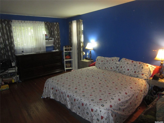 bedroom with wood finished floors