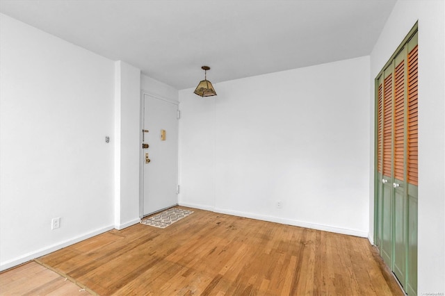 unfurnished room featuring hardwood / wood-style floors