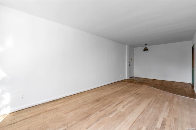 spare room with light wood-type flooring