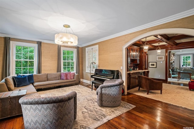 living room with dark hardwood / wood-style flooring, plenty of natural light, and coffered ceiling