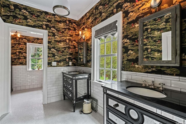 bathroom with vanity, tile patterned floors, tile walls, and ornamental molding