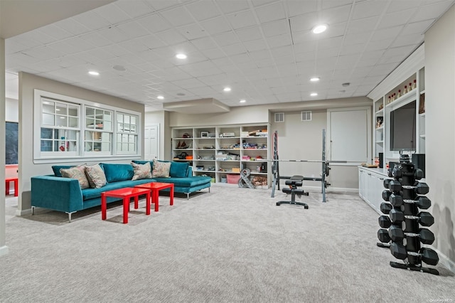 workout room featuring light colored carpet