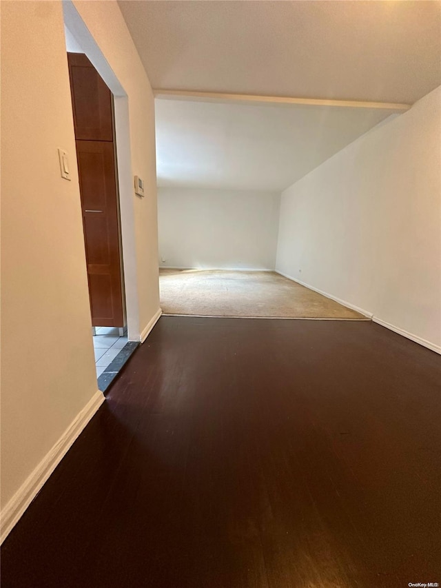 unfurnished room featuring dark hardwood / wood-style flooring