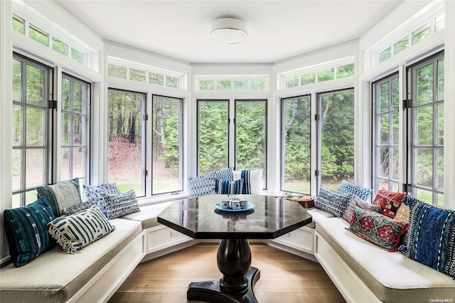 sunroom featuring breakfast area