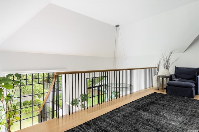 sitting room featuring lofted ceiling and hardwood / wood-style flooring