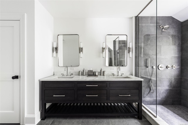 bathroom featuring tile patterned floors, vanity, and tiled shower