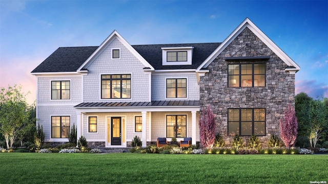 9 Sienna/ Ct, Dix Hills, NY 11746 - view of front of house with a standing seam roof, stone siding, a front yard, and covered porch