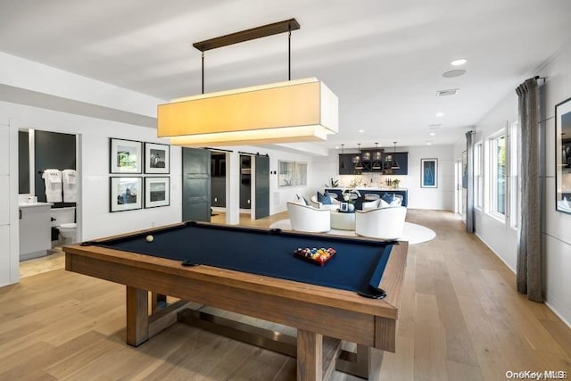 recreation room with bar area, light hardwood / wood-style flooring, and pool table