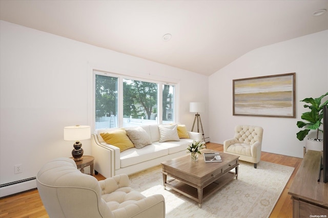 living room with a baseboard radiator, light hardwood / wood-style floors, and vaulted ceiling