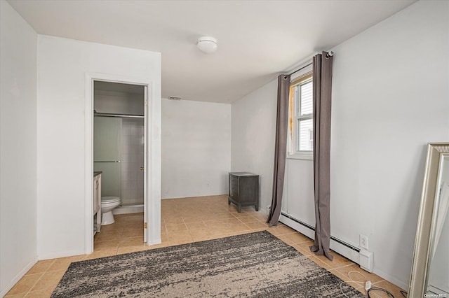 tiled bedroom with connected bathroom