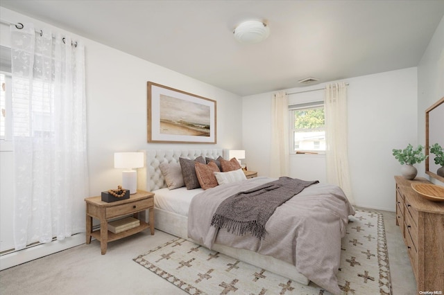 bedroom with light colored carpet