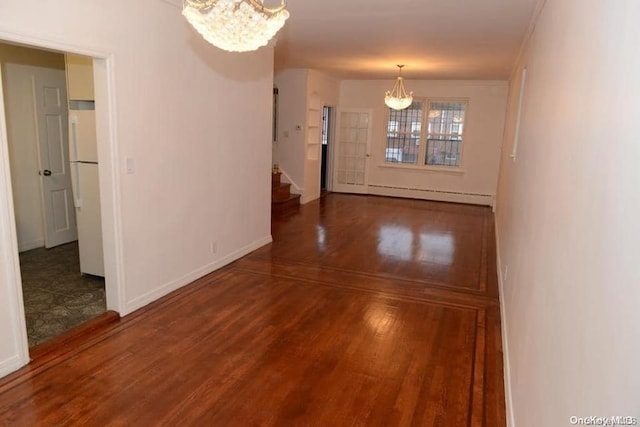 interior space featuring a notable chandelier, wood-type flooring, and a baseboard heating unit