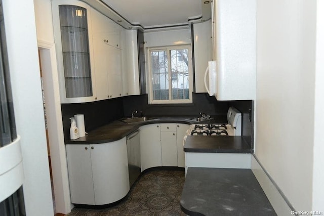 kitchen with white cabinets, white appliances, and sink