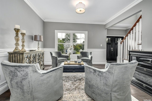 living room with ornamental molding and hardwood / wood-style flooring