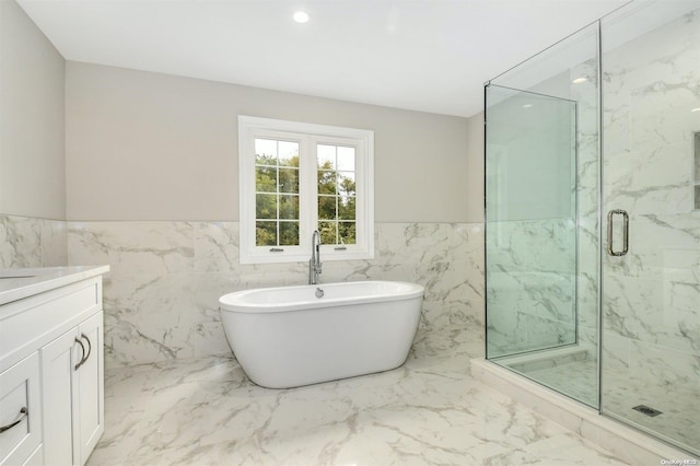 bathroom featuring vanity, tile walls, and plus walk in shower