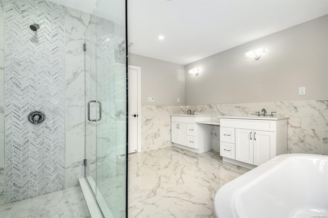 bathroom with vanity, separate shower and tub, and tile walls