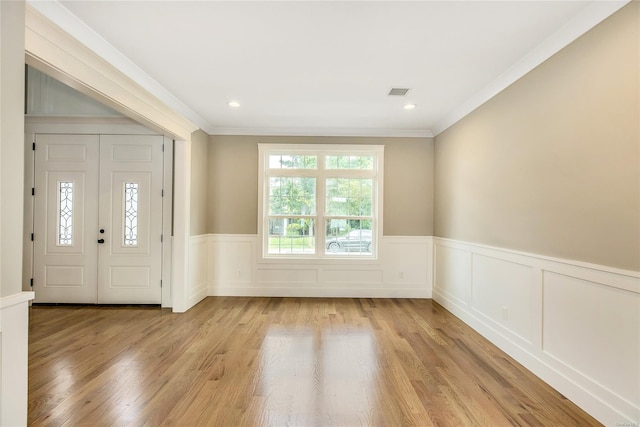 entryway featuring light hardwood / wood-style flooring and ornamental molding