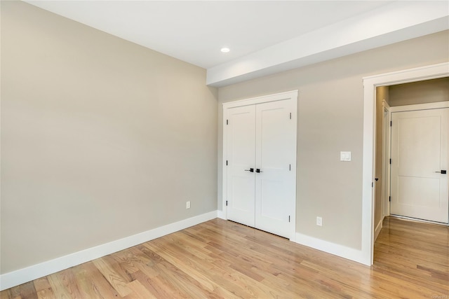 unfurnished bedroom featuring light hardwood / wood-style flooring